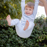 Baby wearing bamboo & organic cotton pajama set in aqua blue color
