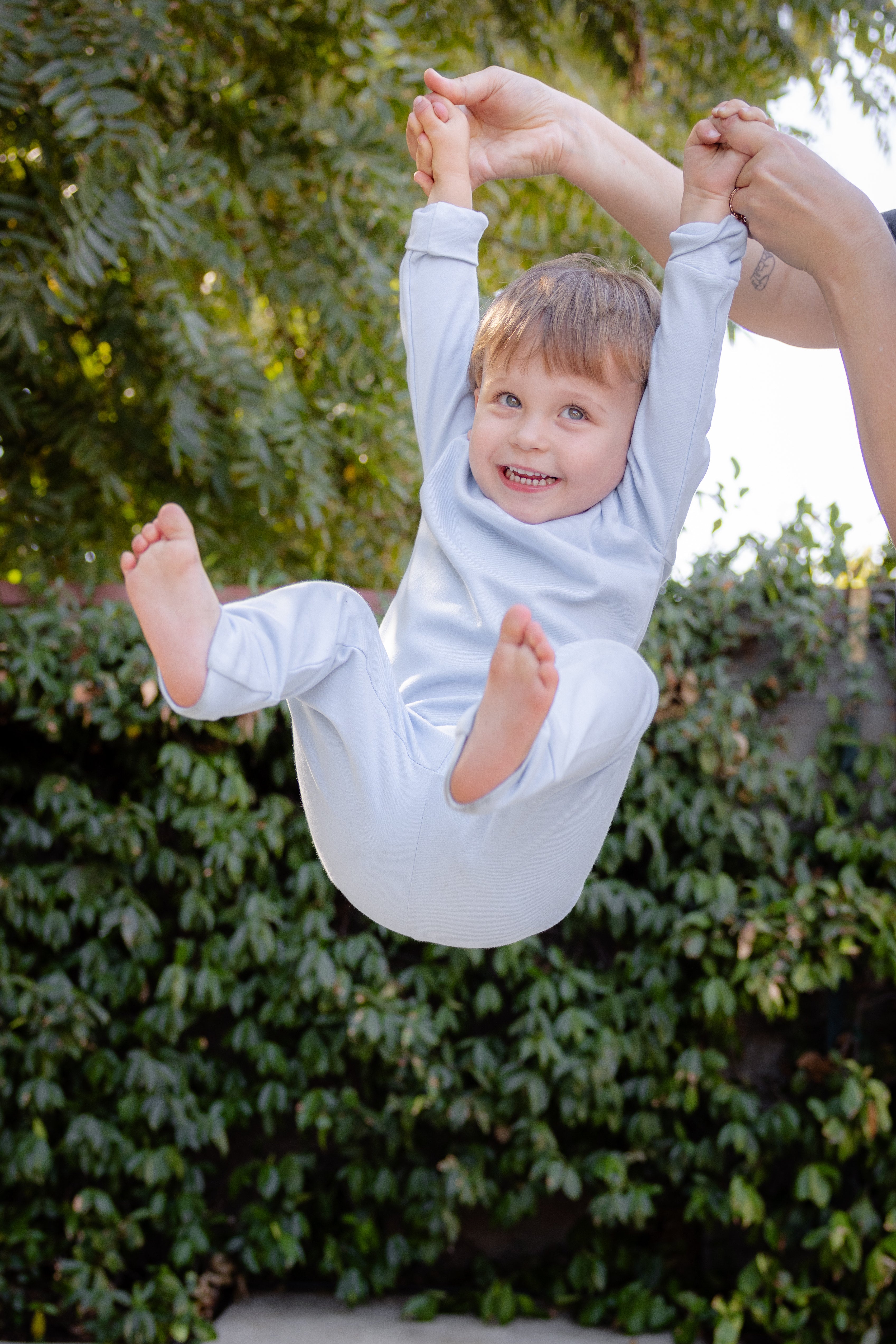 Baby wearing bamboo & organic cotton pajama set in aqua blue color