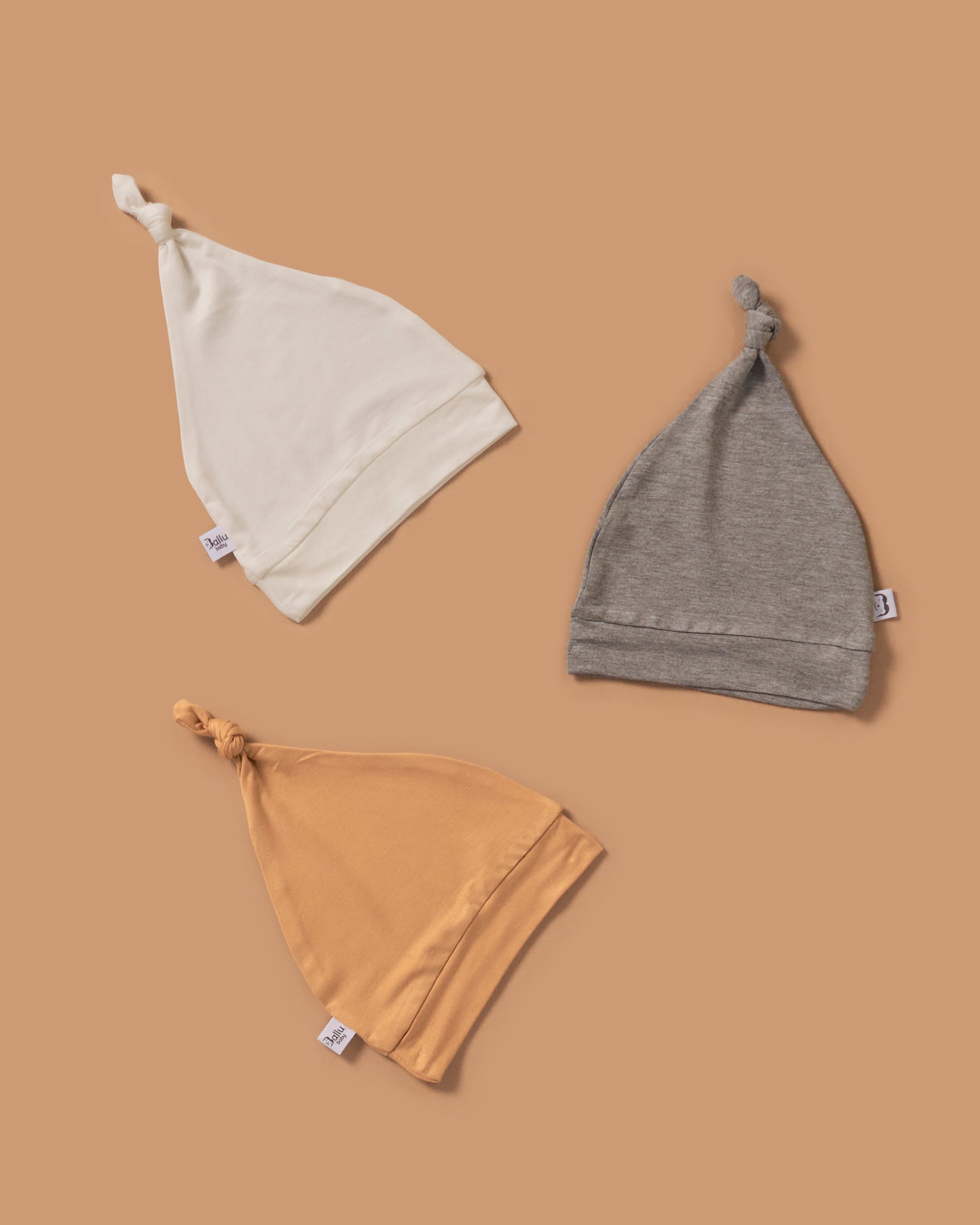 Soft, cozy bamboo knotted hat bundle in 3 colors. Snug and stylish, perfect for newborns and infants with sensitive skin.