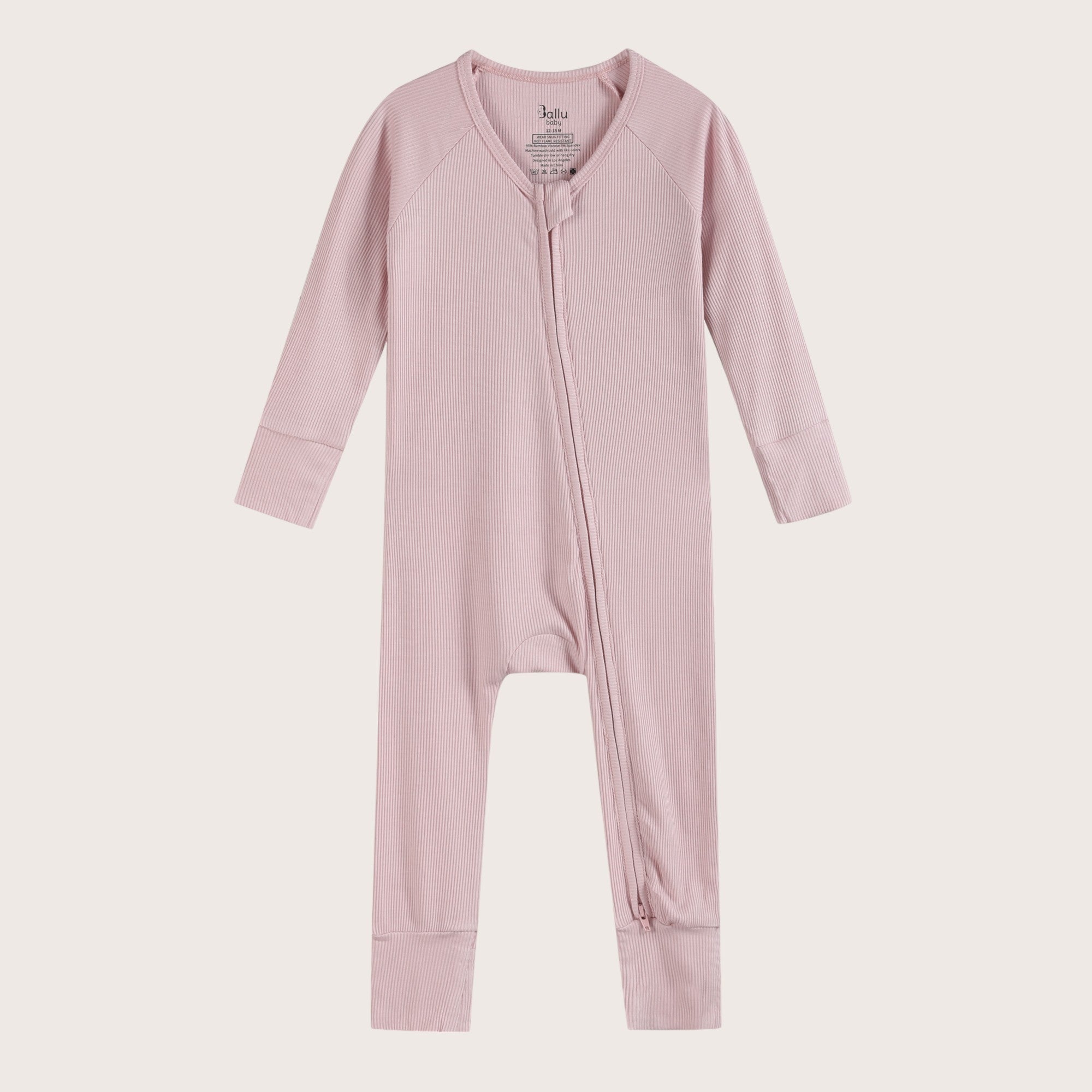 Ribbed bamboo zipper romper in blush pink color featuring practical features for convenience