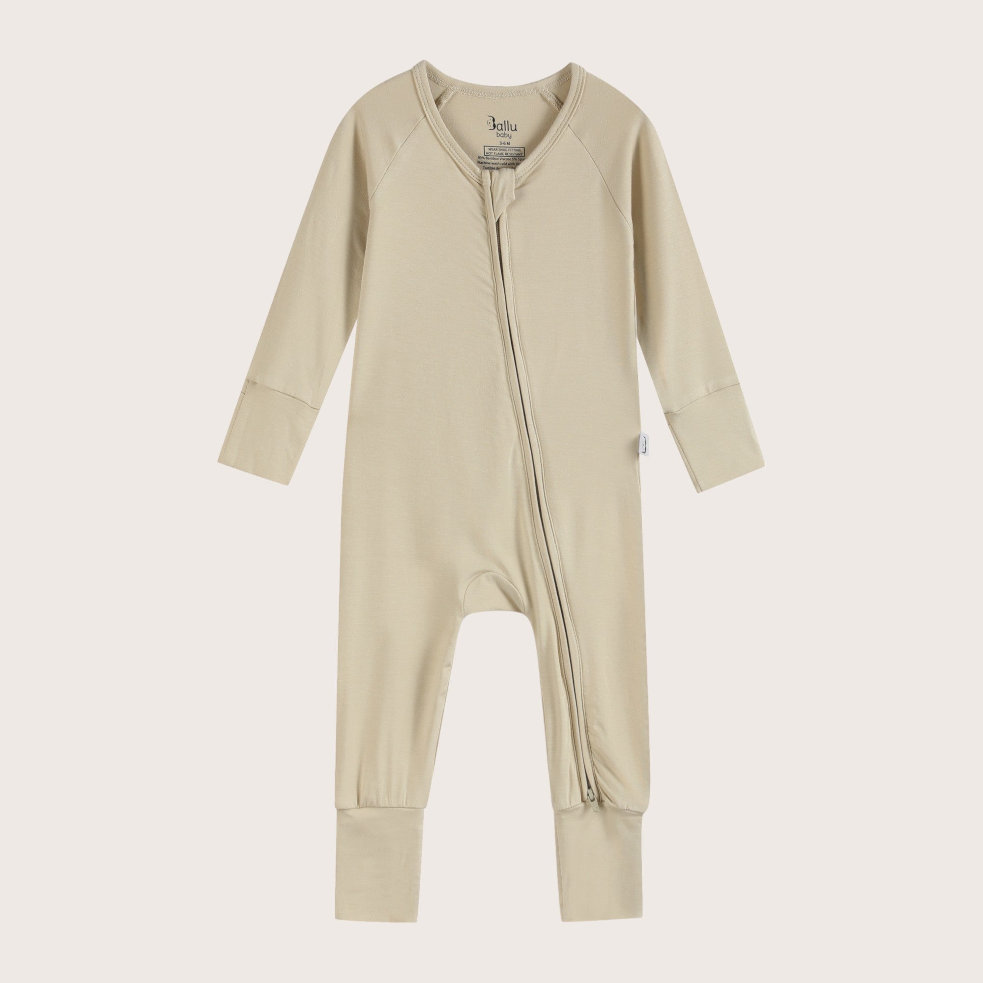 Bamboo Zip Romper and Sleeper in apricot beige color featuring practical features like fold over mittens, footies and two-way zipper