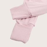 Ribbed bamboo zipper romper in blush pink color featuring fold over footies with grips
