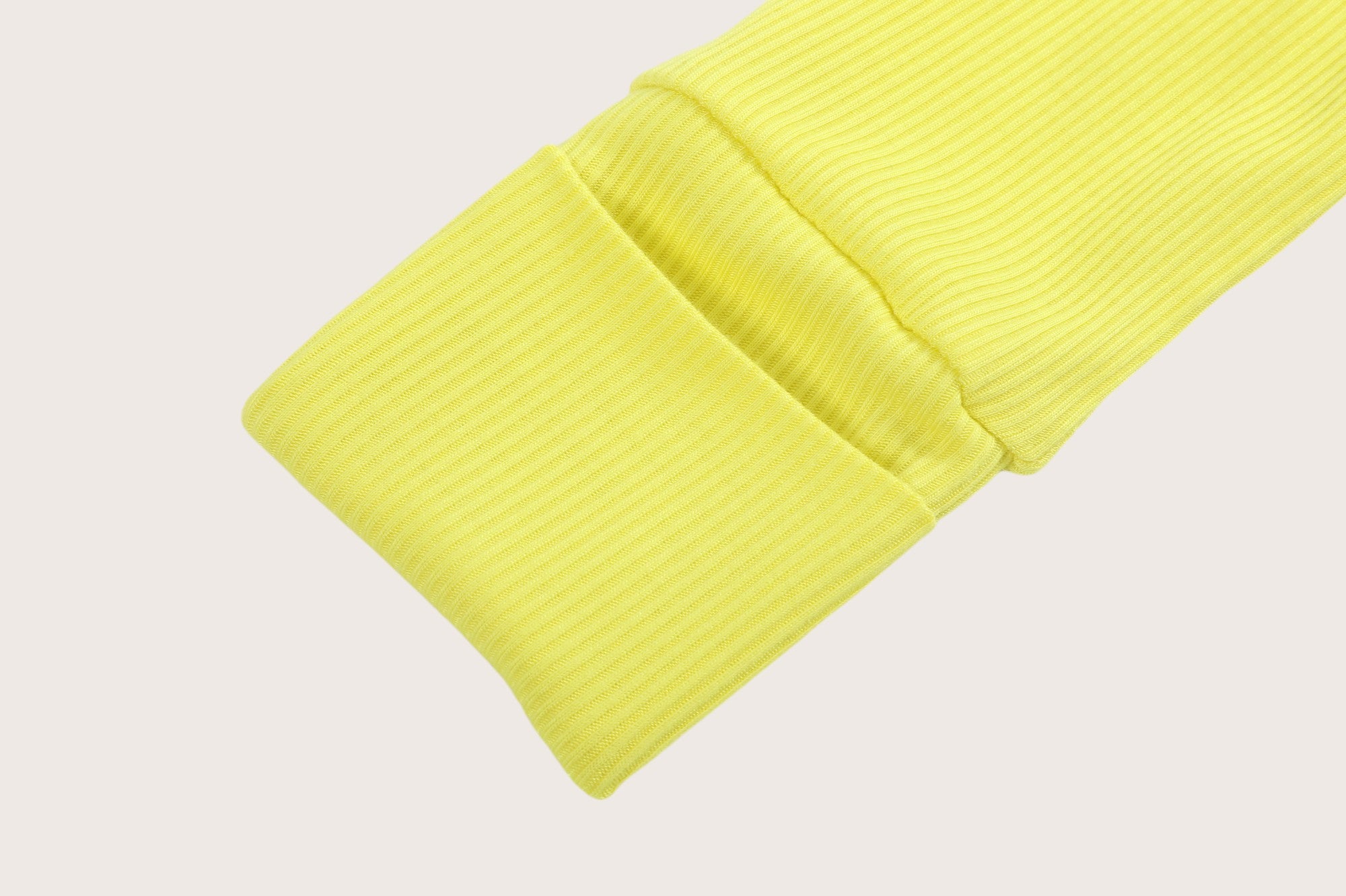 Ribbed bamboo zipper romper in lemon yellow color featuring fold over mittens