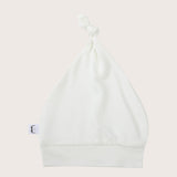 Soft, cozy bamboo knotted hat in white color. Snug and stylish, perfect for newborns and infants with sensitive skin.