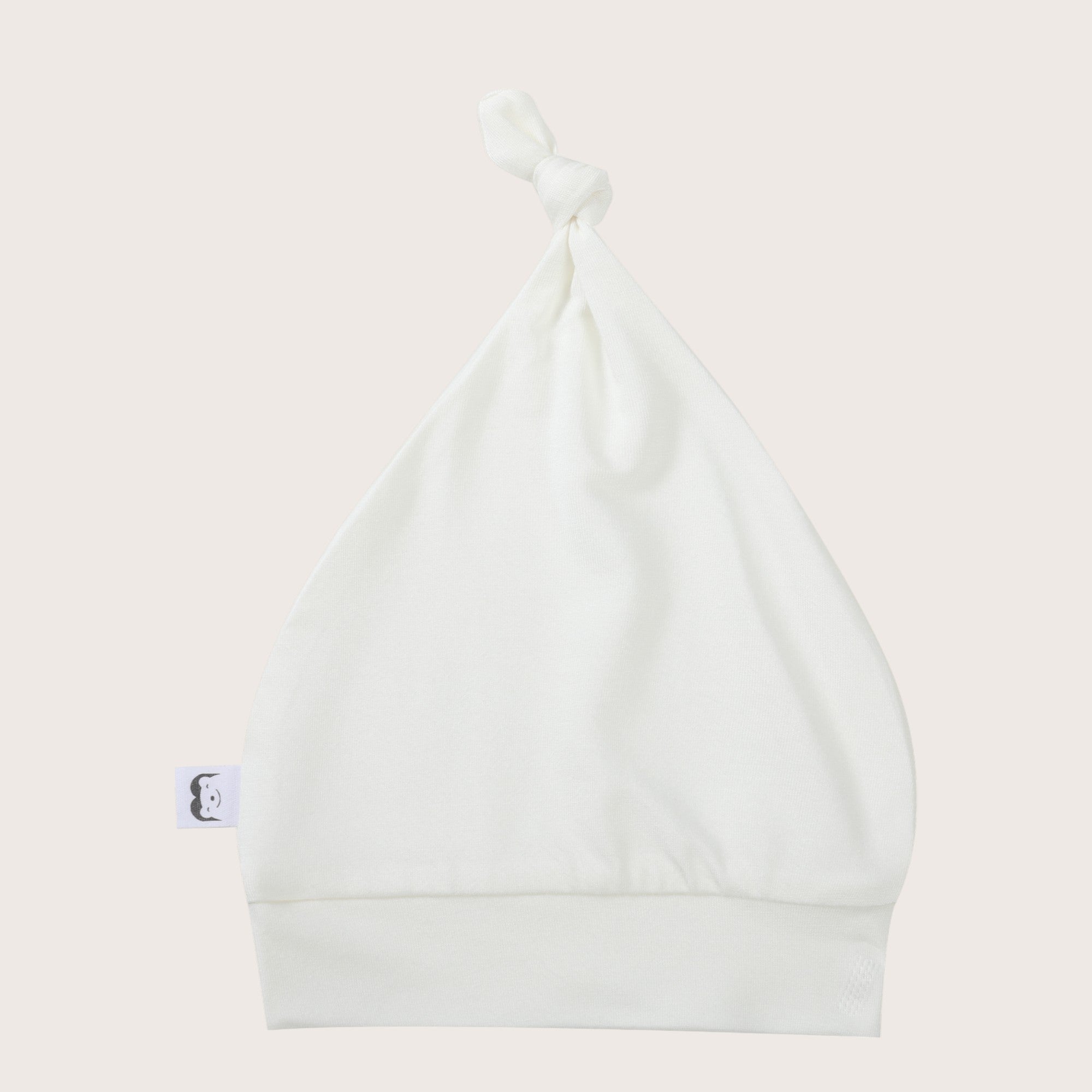 Soft, cozy bamboo knotted hat in white color. Snug and stylish, perfect for newborns and infants with sensitive skin.